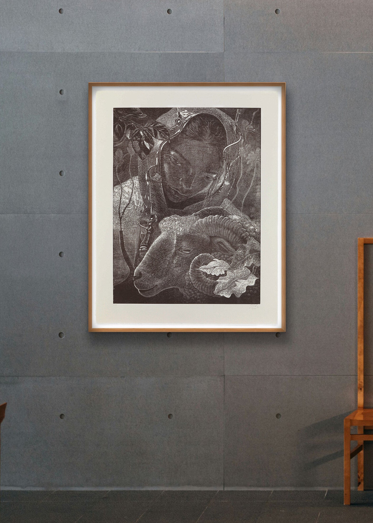 Framed black and white artwork by Dennis Scholl on a gray wall