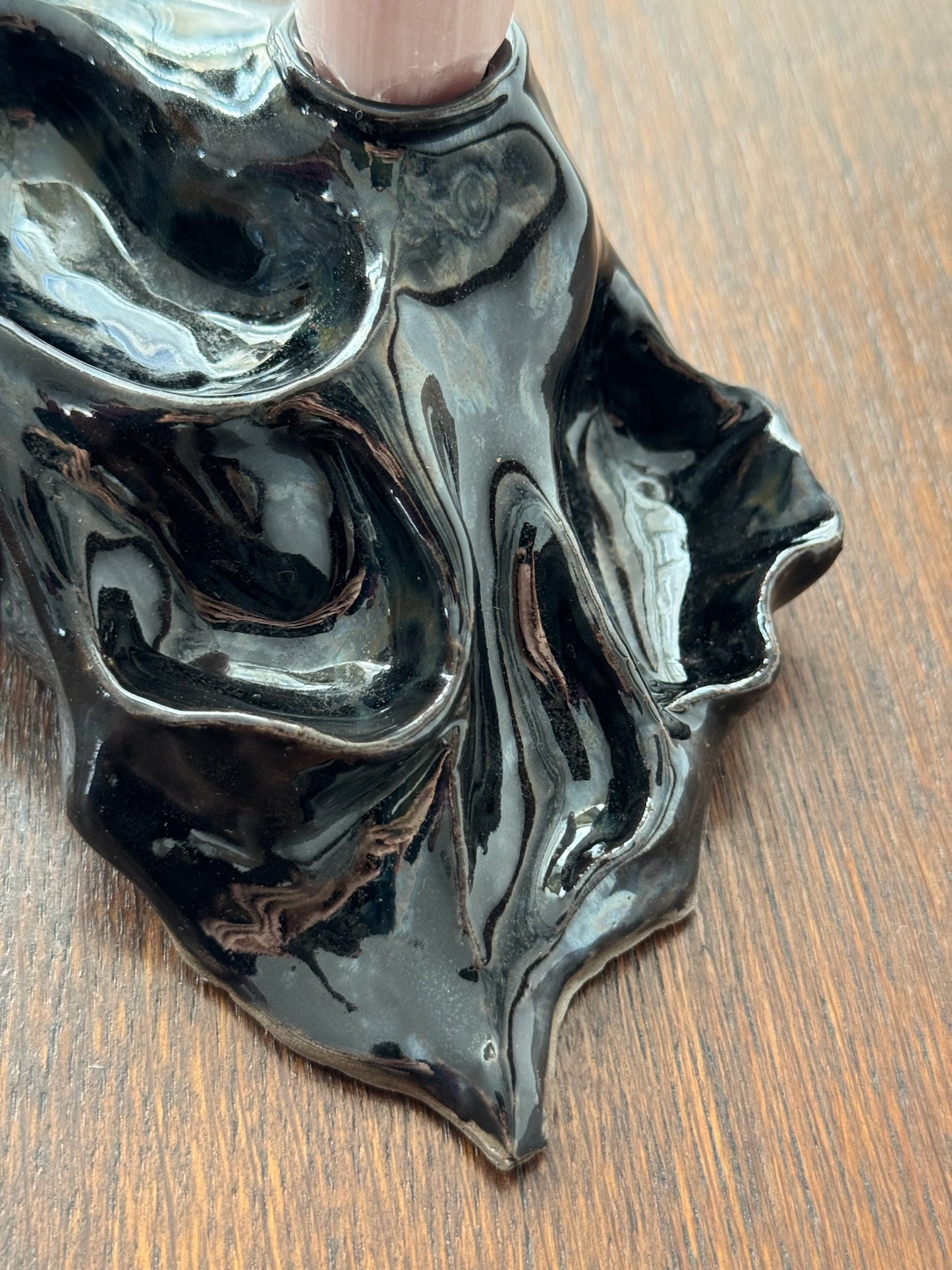 Detail of black candleholder with a textured finish by Aline Schwörer