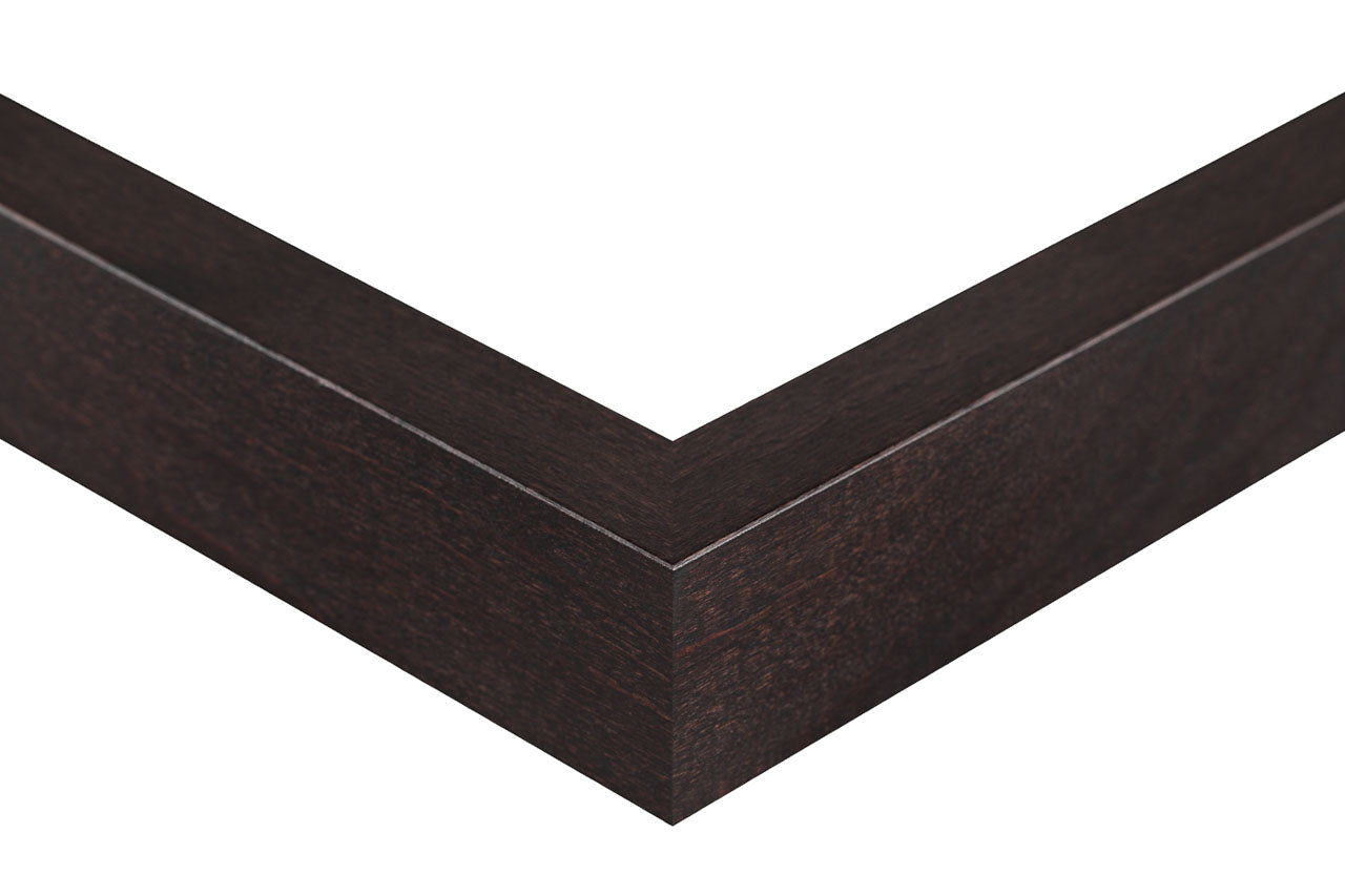 Dark wood picture frame corner on a white background, dark alder frame slat