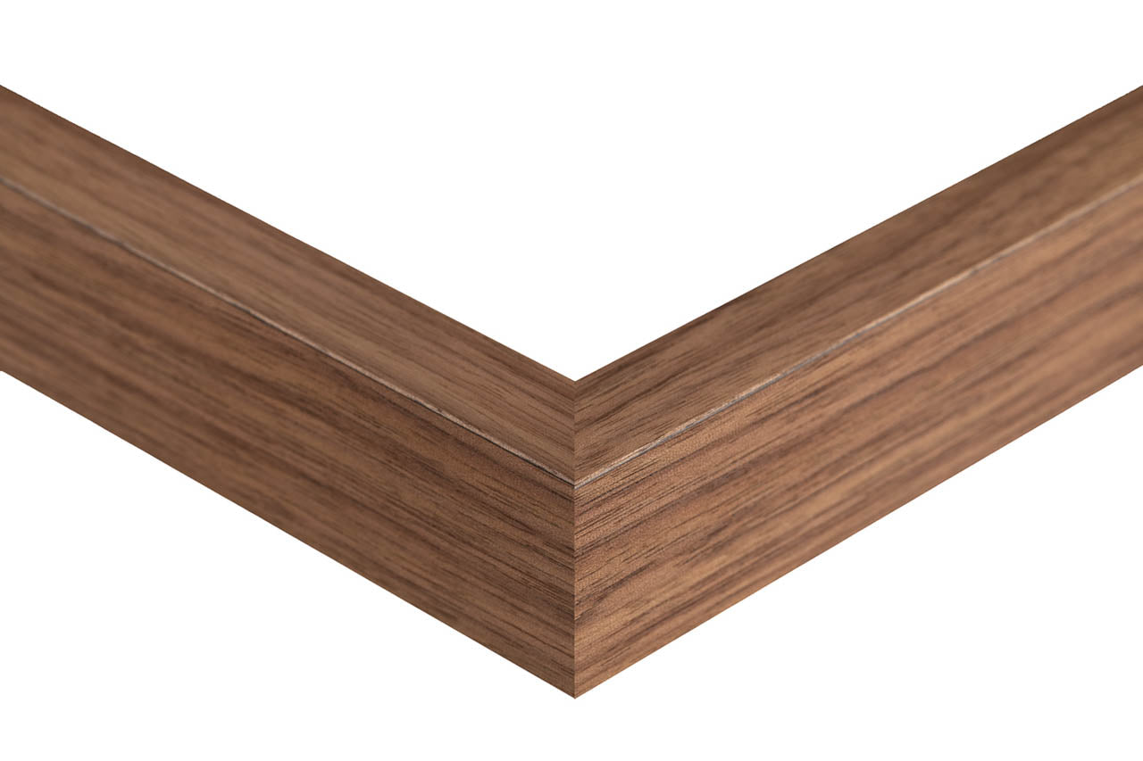 Wooden picture frame corner on a white background, natural walnut frame slat