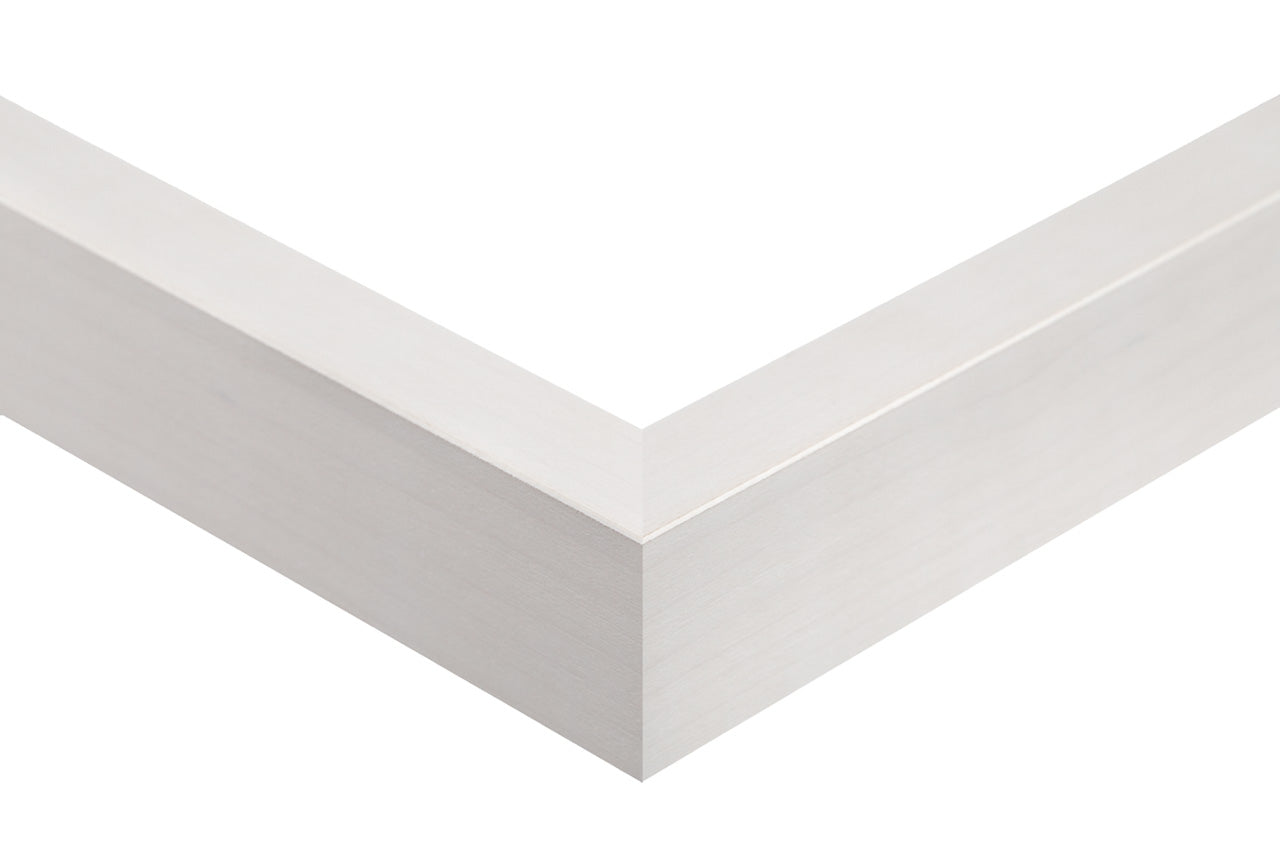 White picture frame corner on a white background, white maple slat