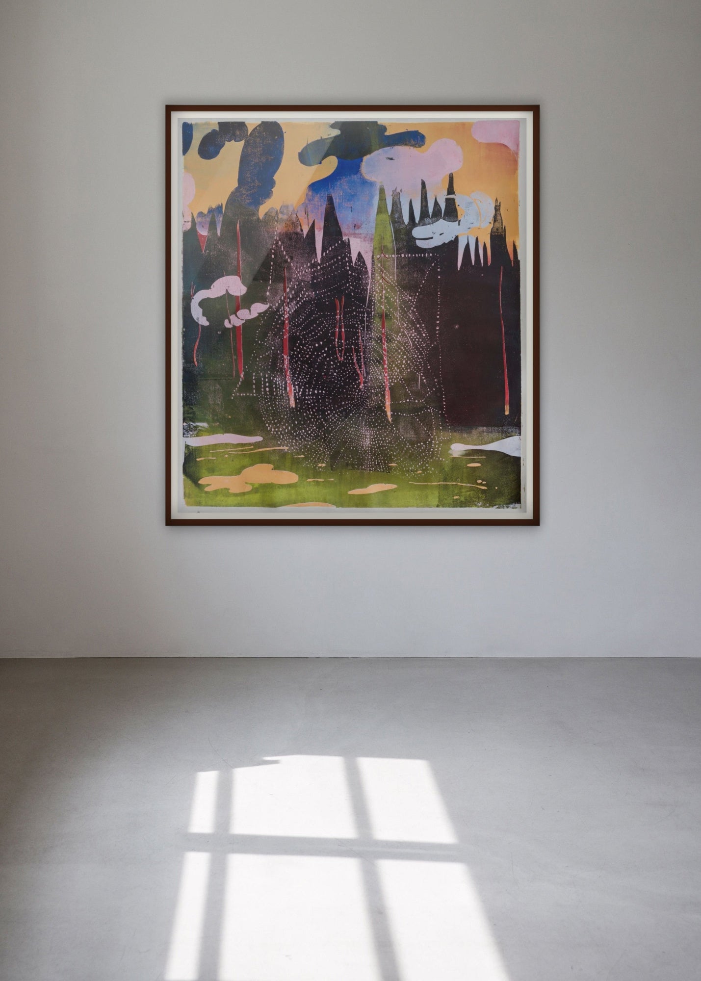 Colorful woodcut "Pandemic Symphony" by Julian Felix Kirchner in a room with grey walls and floor.