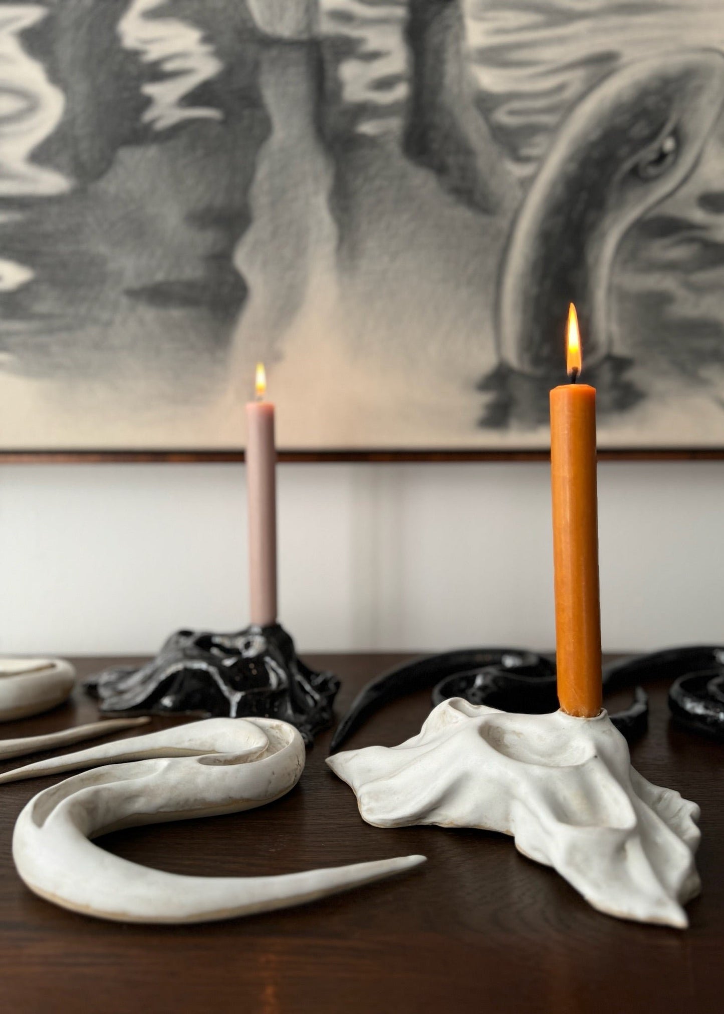 A collection of ceramic artworks in black and white by Aline Schwörer