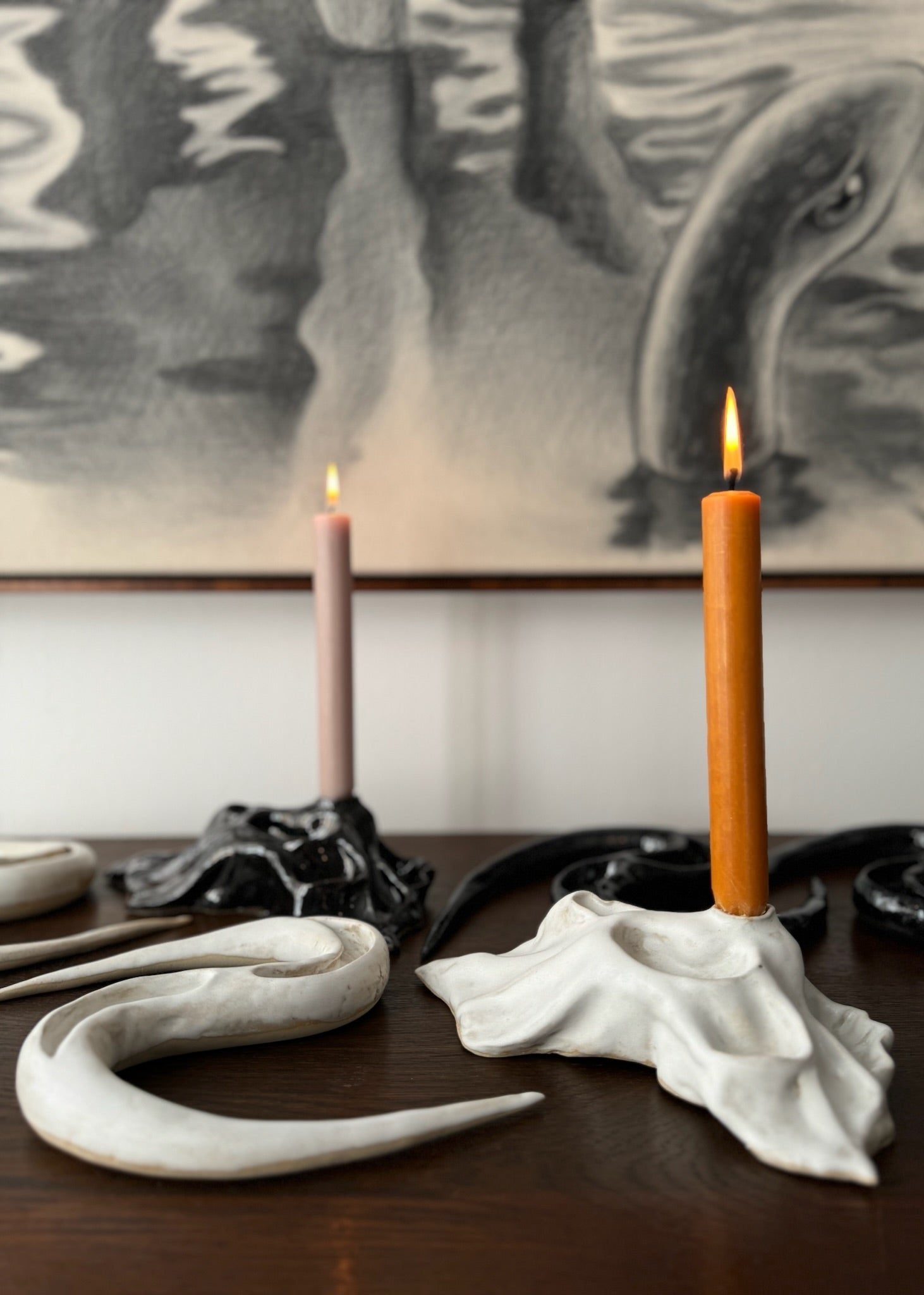 A collection of ceramic artworks in black and white by Aline Schwörer