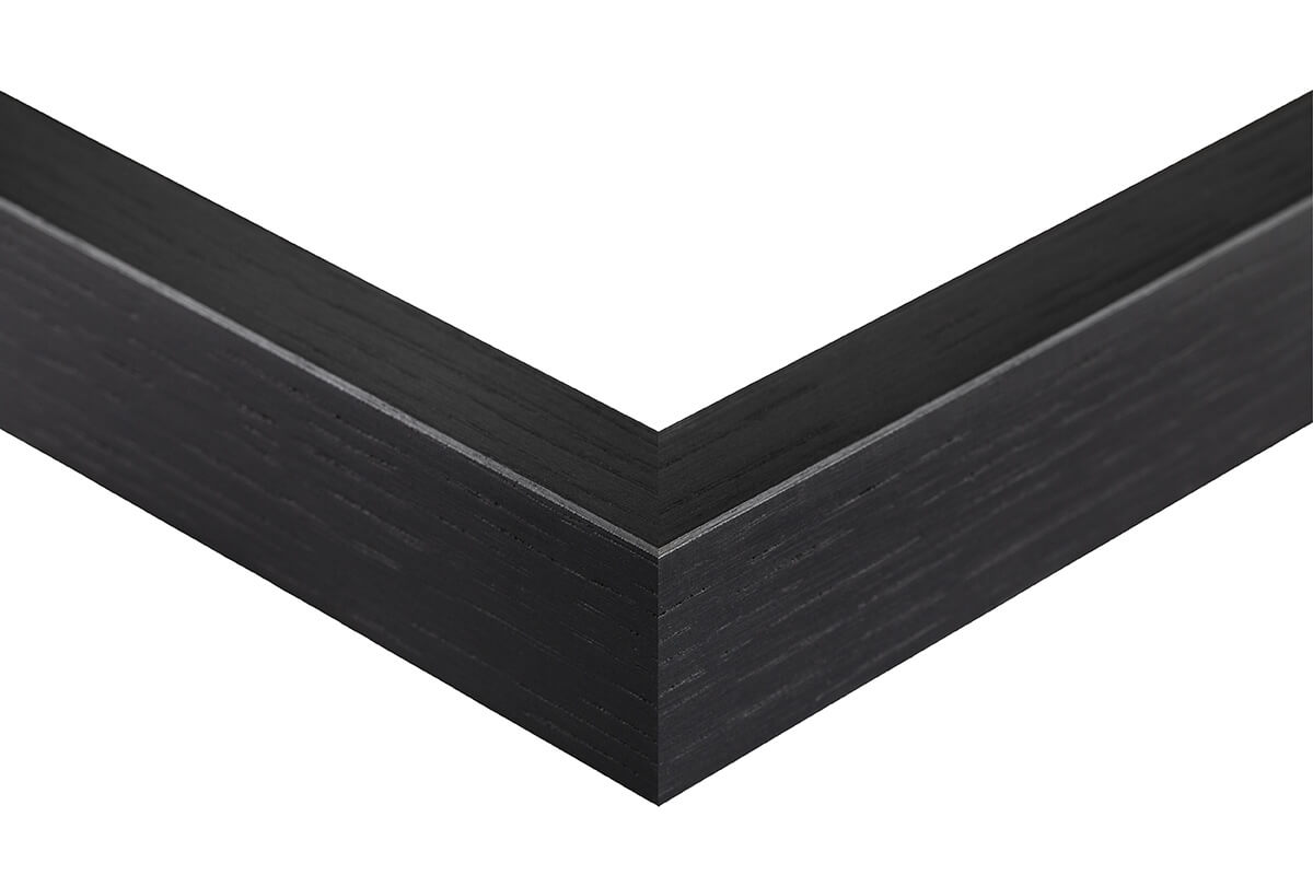 Black picture frame corner on a white background, black oak frame slat