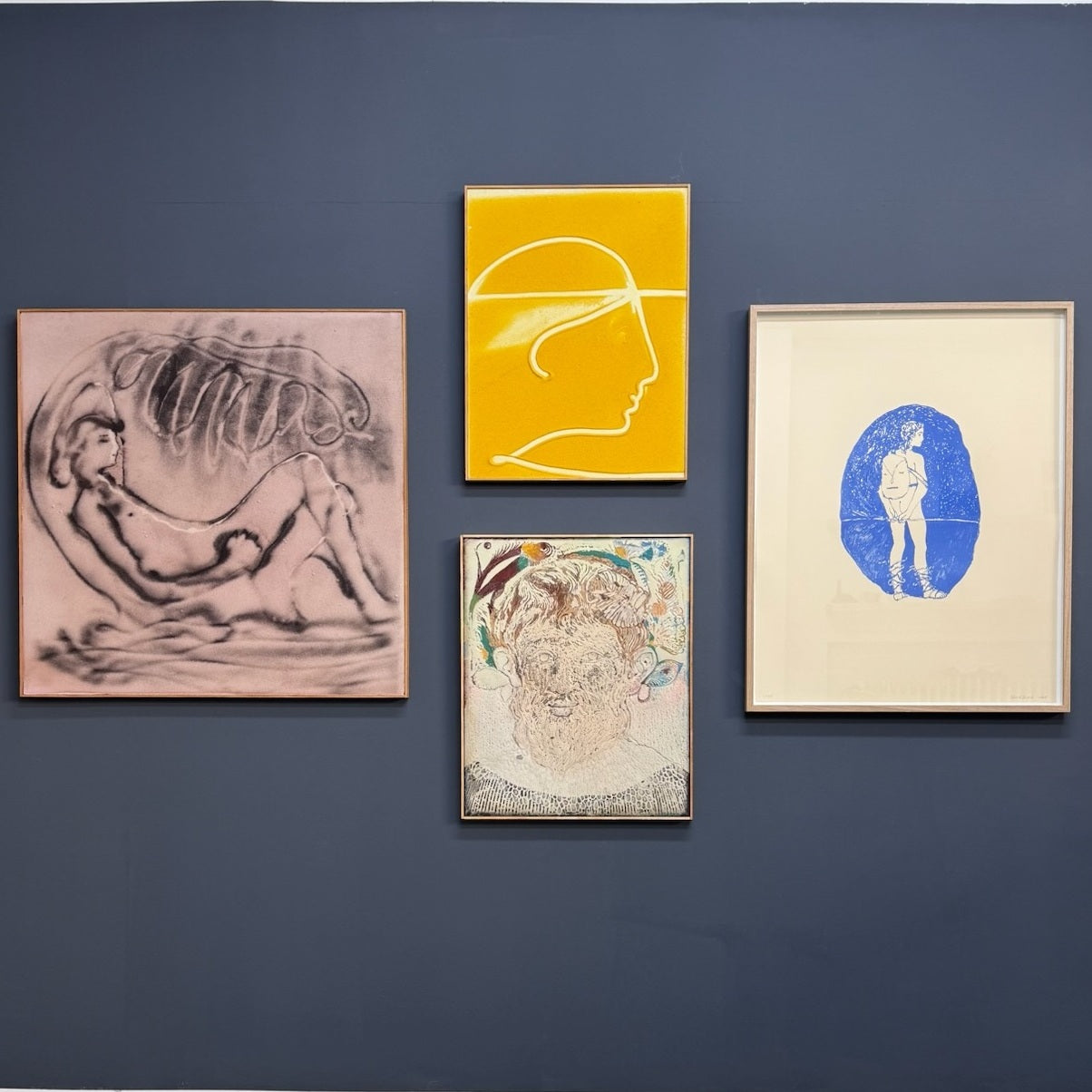 Four framed artworks by Peter Böhnisch on a blue wall