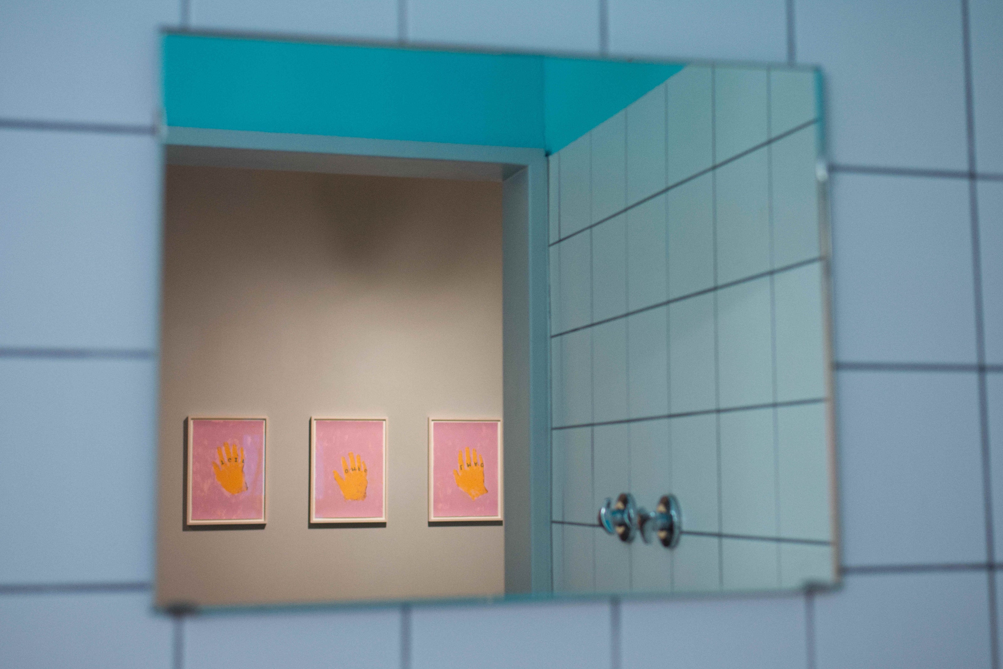 Three Lithographs by Marlon Wobst in a mirror