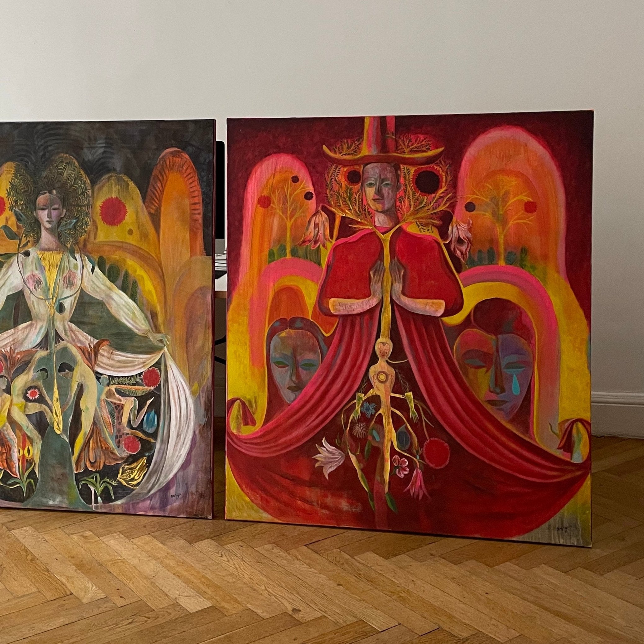 Two colorful paintings by Olaf Hajek in his studio