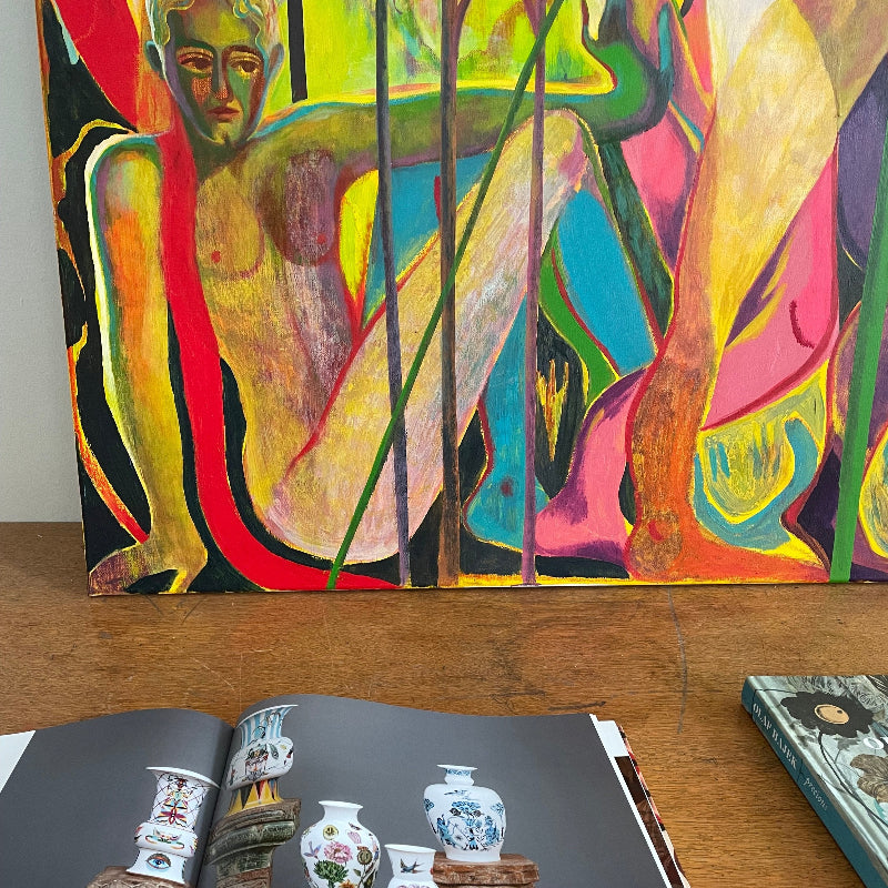 View of a painting and open book in Olaf Hajek's Studio