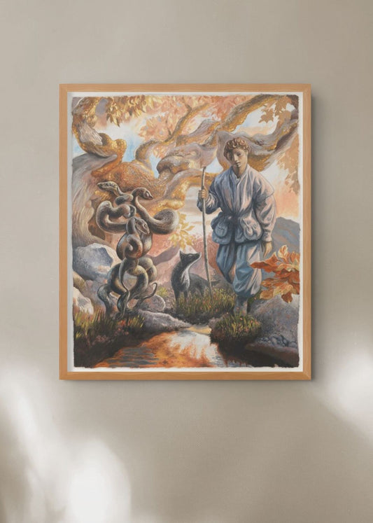 Framed artwork of a person in traditional attire with a mystical landscape on a beige wall.