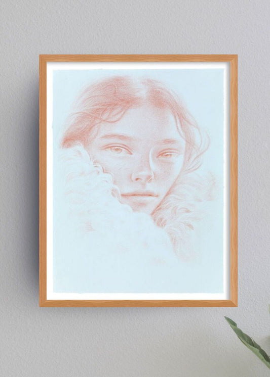 Framed artwork of a woman's portrait on a light gray wall.